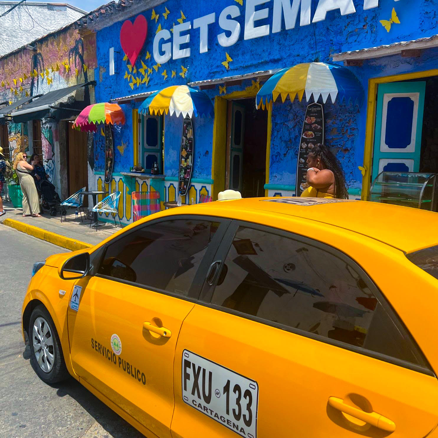 A taxi cab riding through Getsemani, a neighborhood in Cartagena 