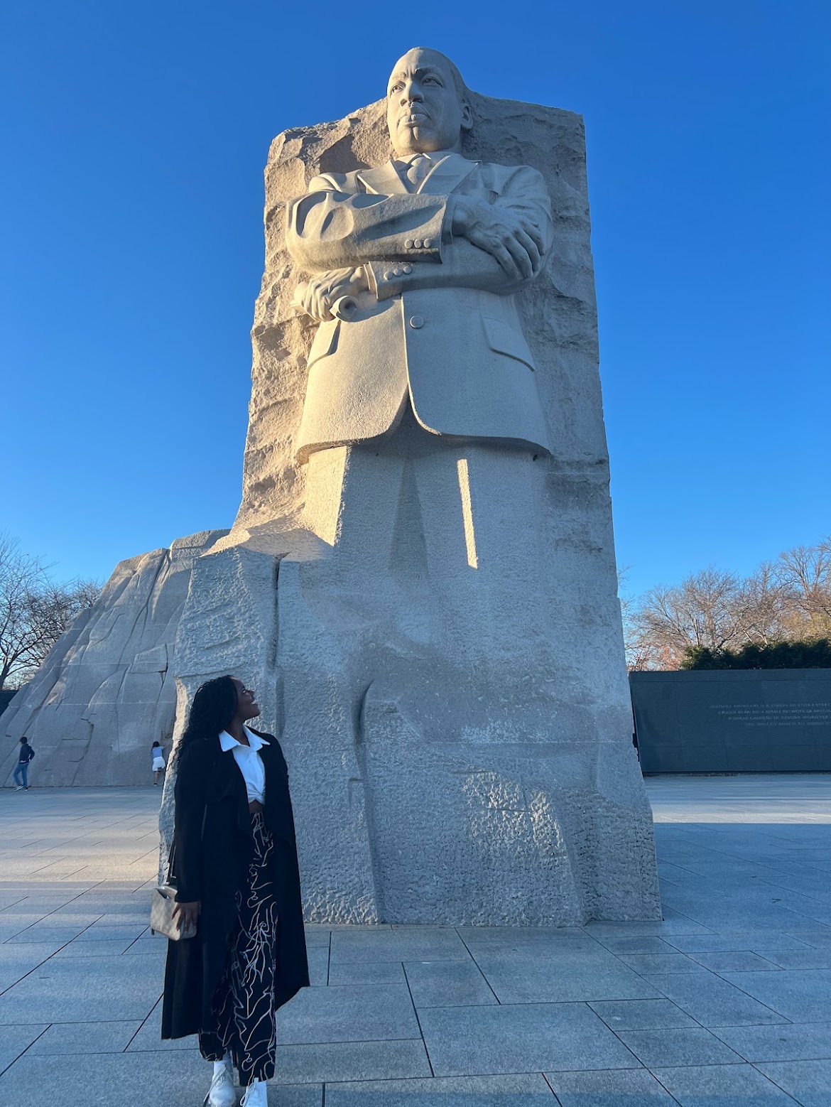 Christina standing next to the MLK Monument in D.C.